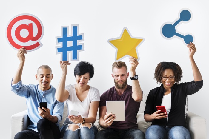 people-holding-an-social-media-icon-P8E9CKY-light